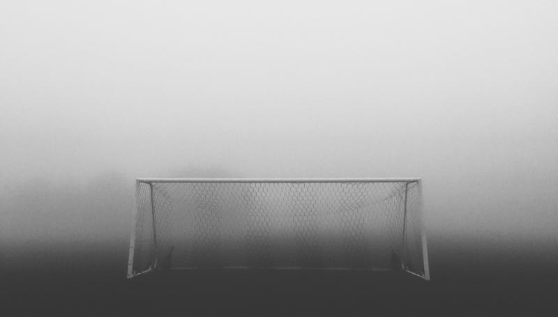 Soccer goal in hazy field